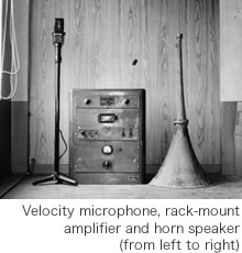 Velocity microphone, rack-mount amplifier and horn speaker (from left to right)