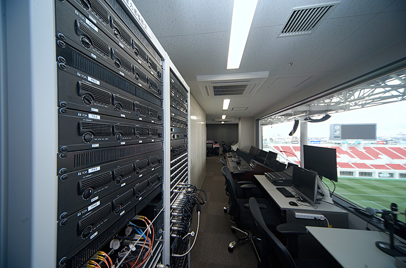 Power amplifier racks in the sound control room house digital power amplifiers, digital wires tuners, and other equipment